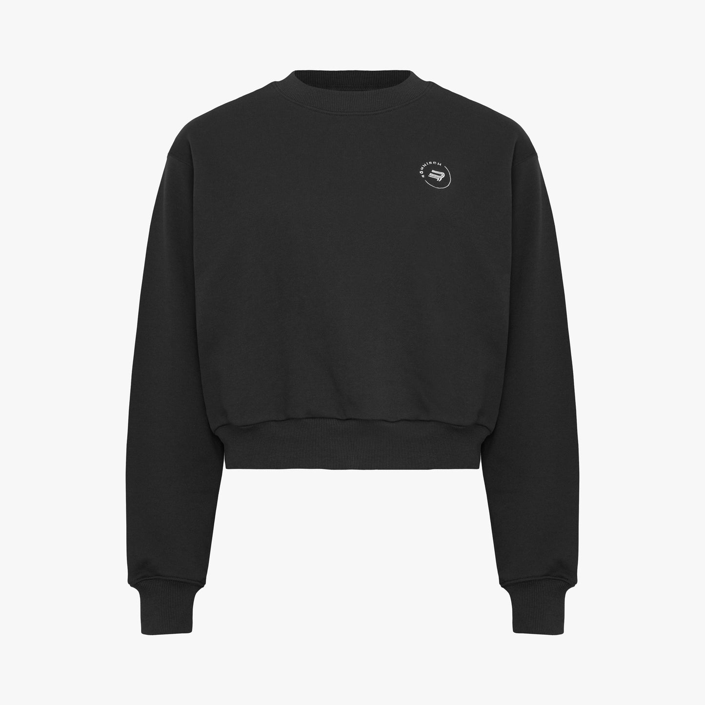 The Soft Sweatshirt by Rohnisch is a black cropped design with long sleeves, made from recycled fabric. It showcases the brand's signature white logo embroidery on the upper left chest.