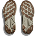 The image shows the soles of a pair of Hoka M Clifton 9, Black/Slate athletic shoes, featuring a textured tread pattern with brown and beige sections designed for responsive toe-off.