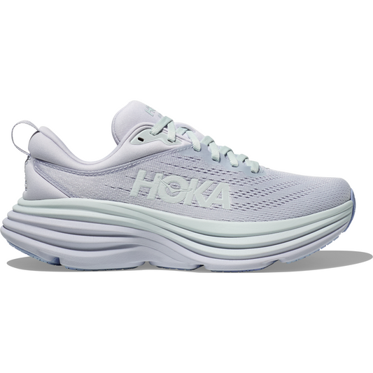 A side view of a lilac Hoka W Bondi 8, Ether/Illusion running shoe with thick soles and "Hoka" branding on the side, featuring softer lighter foams for an enhanced soft ride.