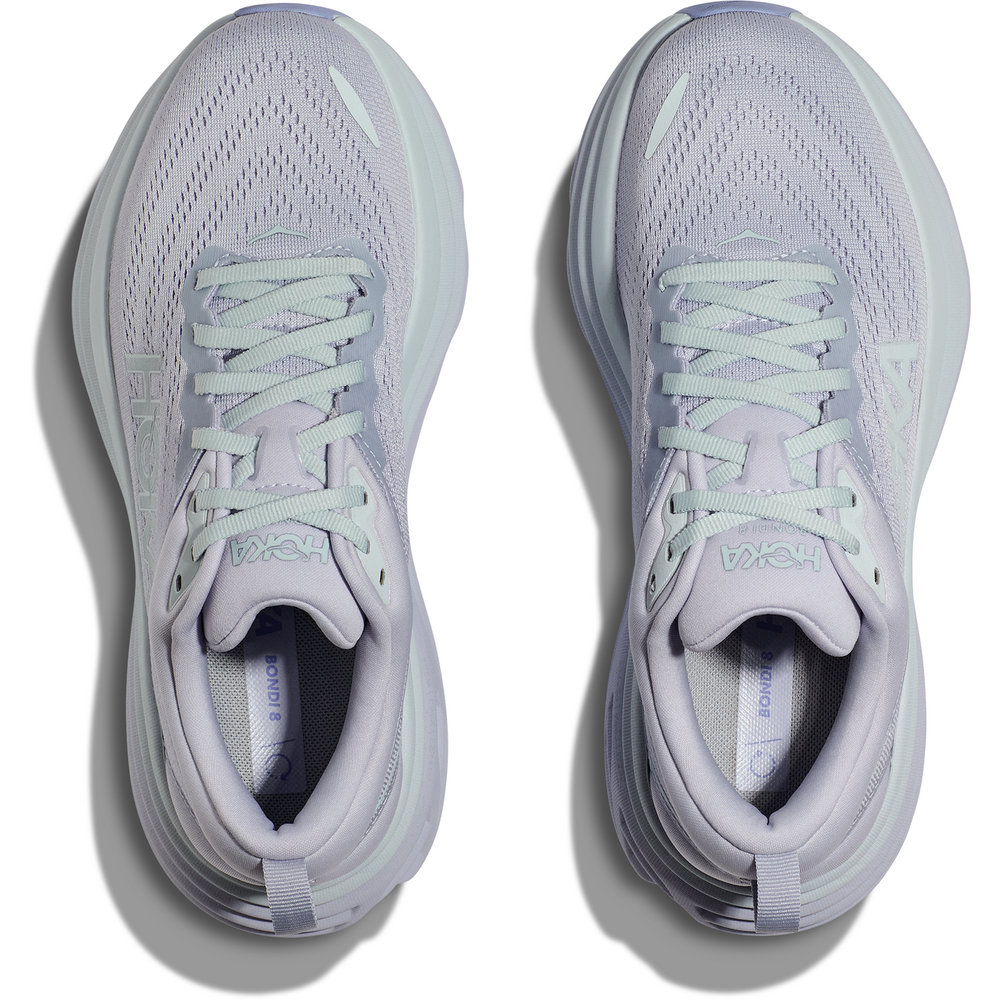 Pair of light lavender Hoka W Bondi 8, Ether/Illusion running shoes with mint green laces viewed from above, showing the tops and insoles, offering an enhanced soft ride with softer, lighter foams.