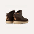 Pair of Ugg's All Gender Campfire Crafted Regenerate brown suede ankle boots, with beige soles, leather laces, and an UGGplush™ liner for added comfort, viewed from the back on a neutral background.