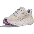 A white and purple Hoka W Clifton L BP, Nimbus Cloud/Nimbus Cloud shoe with a thick sole, geometric cutouts on the sides, and floral embroidery for a stylish touch, offering a lightweight ride.