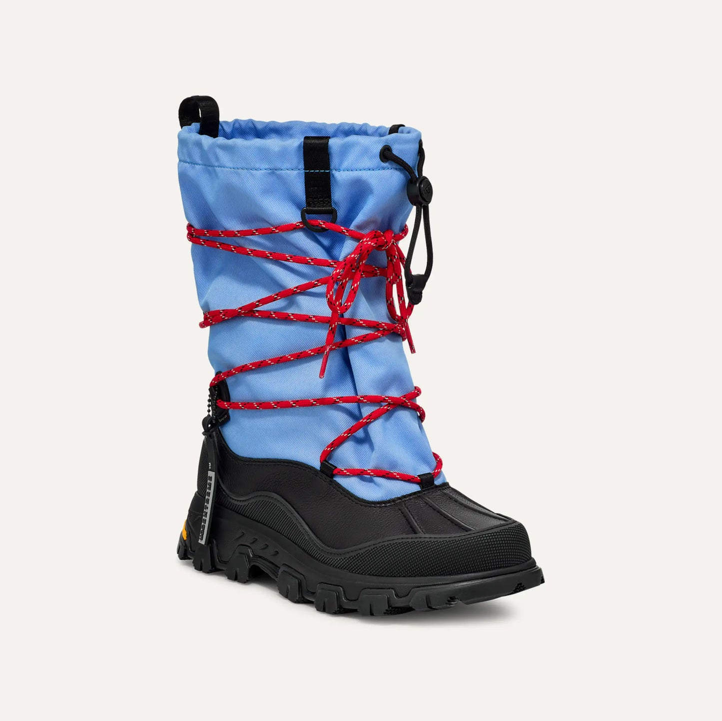 Introducing the Ugg W Metropeak: a chic winter boot with a black sole, blue upper, and red laces. It features a drawstring closure for a waterproof design that keeps your feet dry and warm all season.