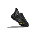 The Hoka U Mafate Speed 4 Lite is a black athletic shoe featuring a textured sole and breathable mesh upper, pictured from an angled perspective.