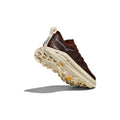 The U Mafate Speed 4 Lite by Hoka is a brown and beige trail running shoe with breathable mesh and a textured sole, shown at an angle from the back against a white background.