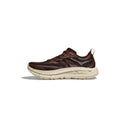 The Hoka U Mafate Speed 4 Lite is a brown and beige athletic shoe with a chunky sole, featuring breathable mesh upper and side stripes on a white background, along with a comfortable PROFLY midsole.