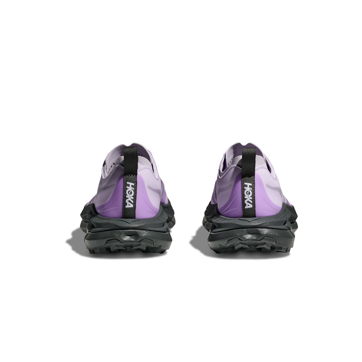 The purple and black Hoka U Mafate Speed 4 Lite trail running shoes, shown from the back, boast rugged soles, breathable mesh uppers, 'HOKA' branding on rear pull tabs, and a PROFLY midsole for a comfortable technical trail experience.