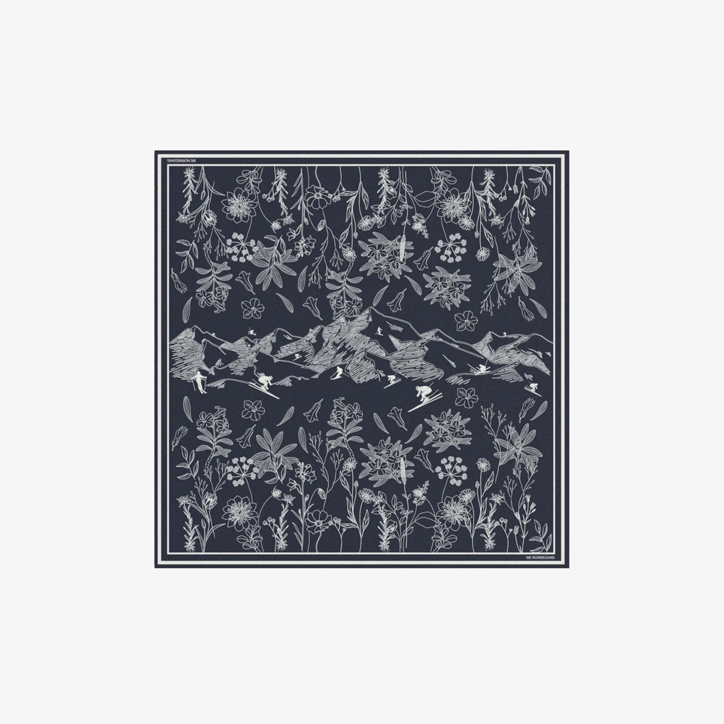 The Alps Silk Scarf by We Norwegians features intricate white floral and mountain patterns on a dark square backdrop, framed by thin white borders.