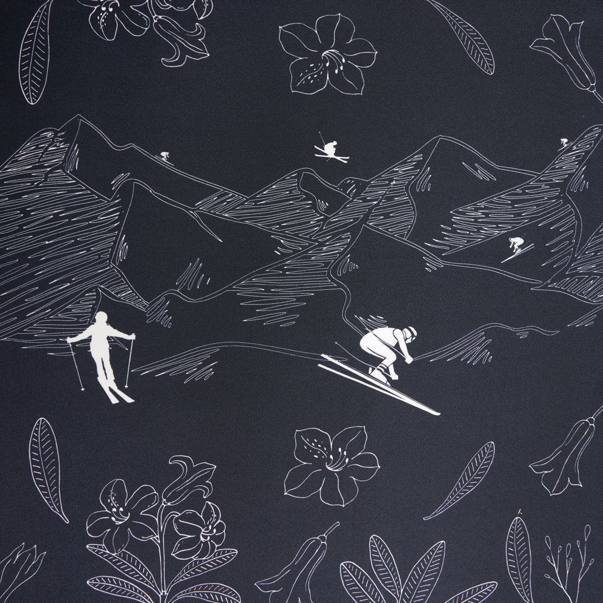 A monochromatic Alps Silk Scarf by We Norwegians showcases skiers in a mountainous landscape adorned with floral and bird motifs.