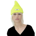 A person with light hair is wearing a bright yellow Le Bonnet Logo Beanie and a black top, facing forward.