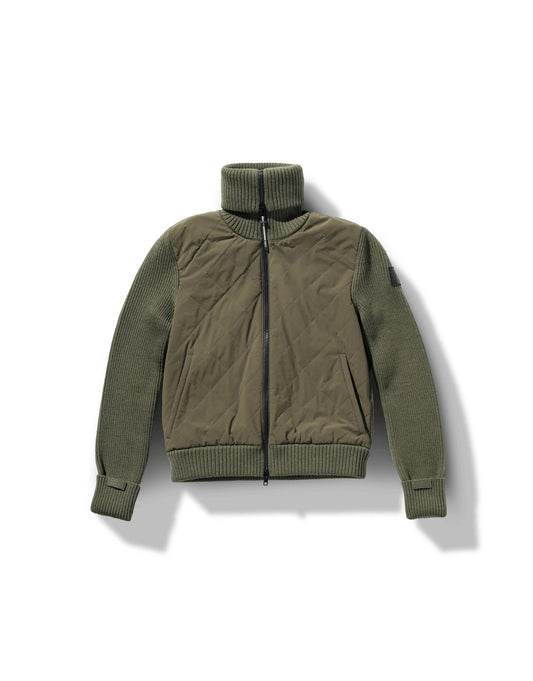 The Ada Women's Quilted Full Zip Sweater by Nobis features an olive green design with ribbed sleeves, a high collar, and adjustable cuffs. It includes PrimaLoft Gold Insulation Active+ for lightweight warmth and a Durable Water Repellent finish to keep you dry.