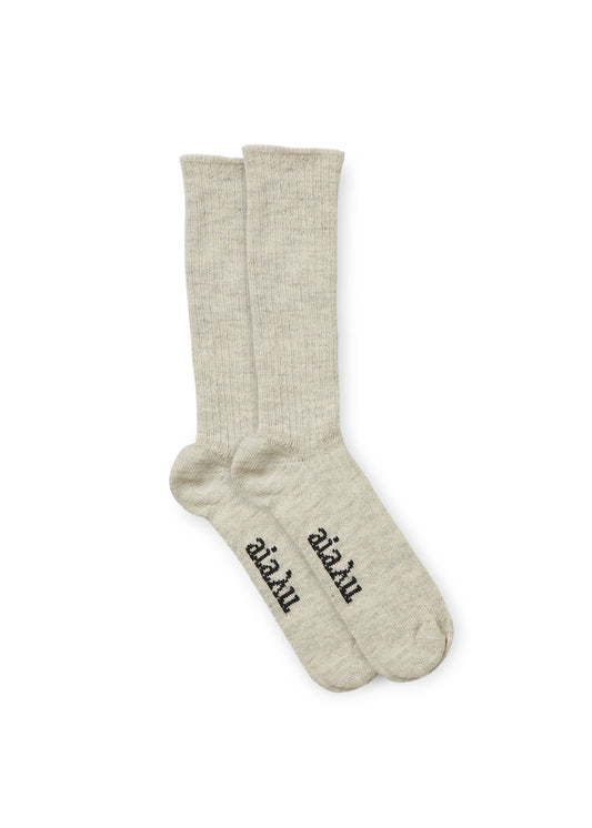 A pair of Llama Socks in light gray, featuring the Aiayu brand name in black near the toes, positioned neatly side by side against a white background.