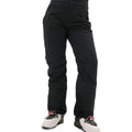 A person wearing Halfdays' Alessandra Pant in classic black, paired with white ski boots accented in red and black.