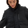 A person wearing the Davis Convertible Jacket by Halfdays, which features removable sleeves, a high collar, and a zippered pocket, looks down.