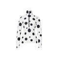 The Dottie Ski Pully in Dot Cream by Goldbergh is a white long-sleeve shirt adorned with black polka dots, a high collar, and a front zipper.