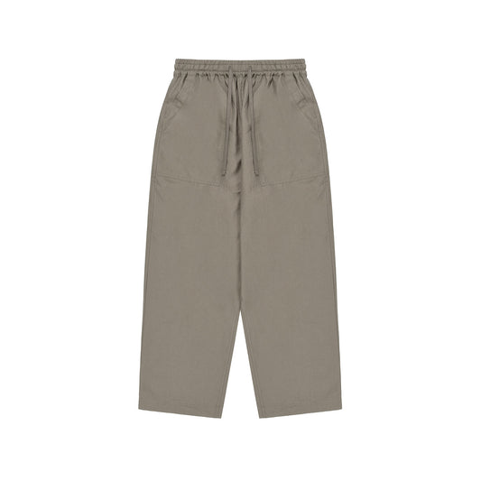 Kappy's Easy Fatigue Pants are olive green, wide-leg unisex pants with an elastic waistband and drawstring. Featuring large front pockets, these one size fits most cotton pants provide comfort and style for all.