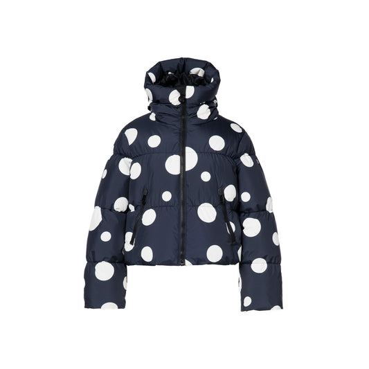 Goldbergh's Grand Ski Jacket in Dot Black is a navy blue puffer with large white polka dots, featuring a high collar and front zipper.