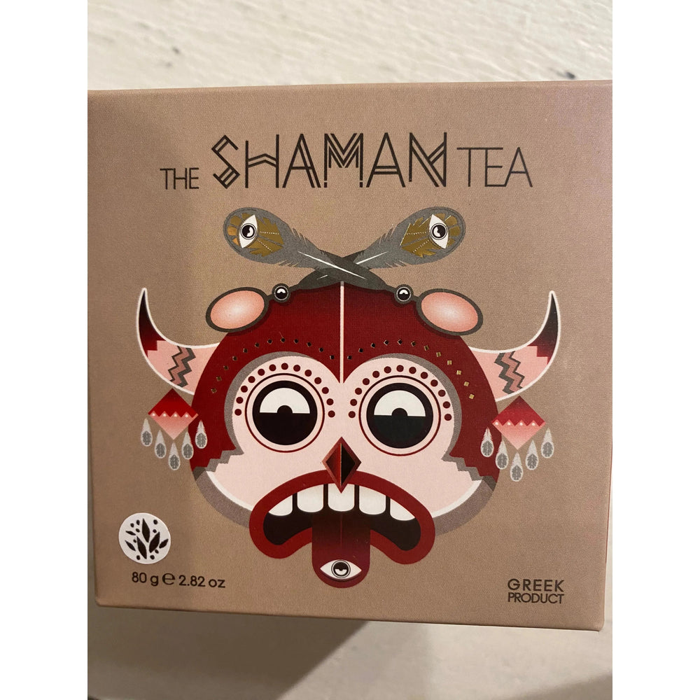 A box of "The Shaman Tea" by Westerlind, displaying vibrant graphic art of a whimsical face with horns and stylized decorative elements. The box states it is a Greek product, weighing 80g (2.82 oz).