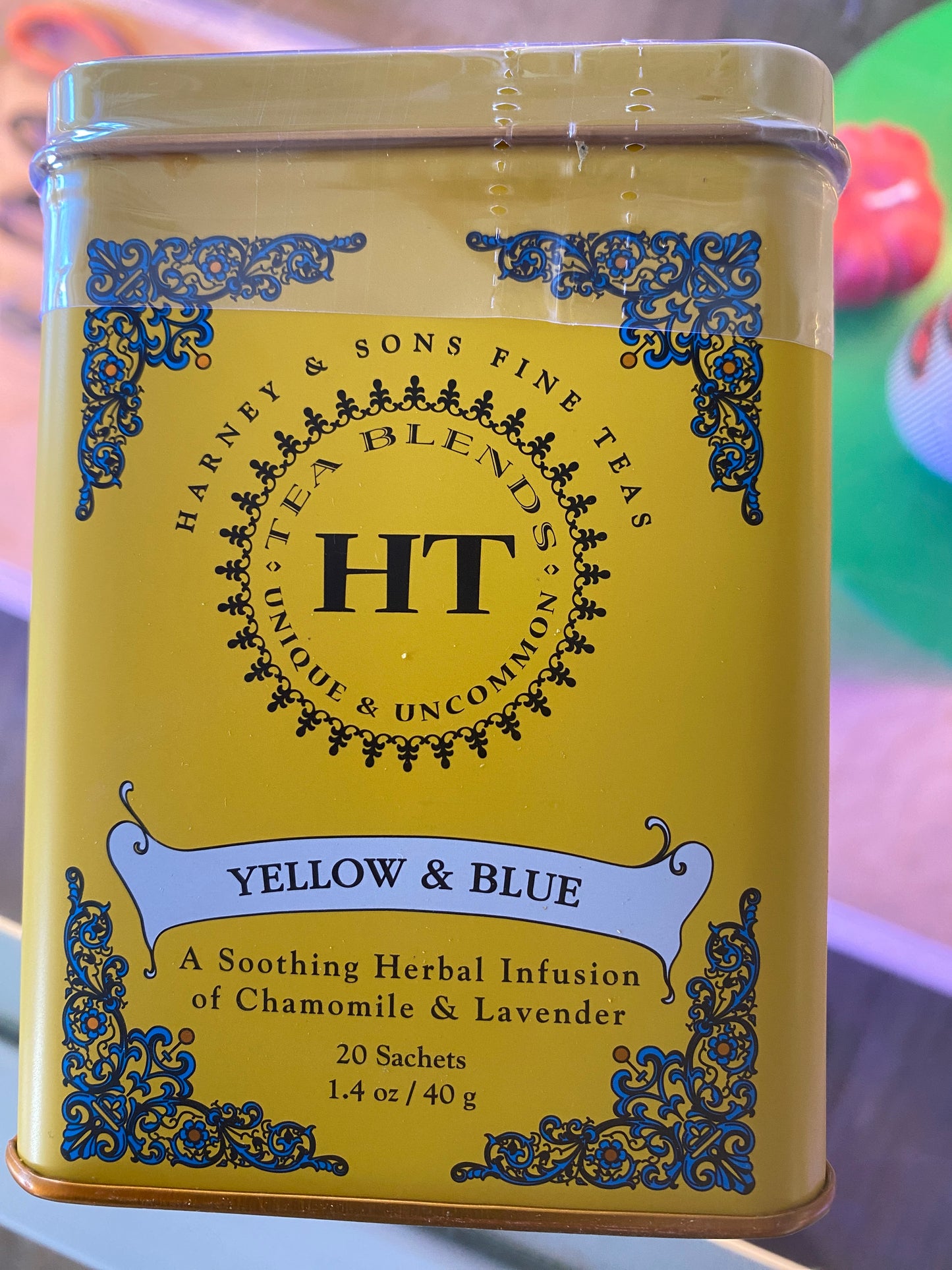 A yellow tin from Westerlind, labeled "Yellow and Blue Tea - Harney," holds 20 sachets of chamomile and lavender herbal infusion.