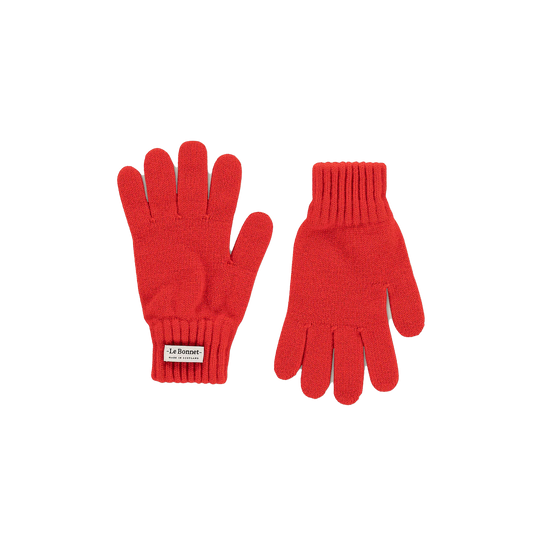 Ideal for chilly weather, this pair of Le Bonnet red knit gloves with ribbed cuffs is made from luxurious Merino wool. With a small label on one glove, they add a cozy Scottish charm to your wardrobe.