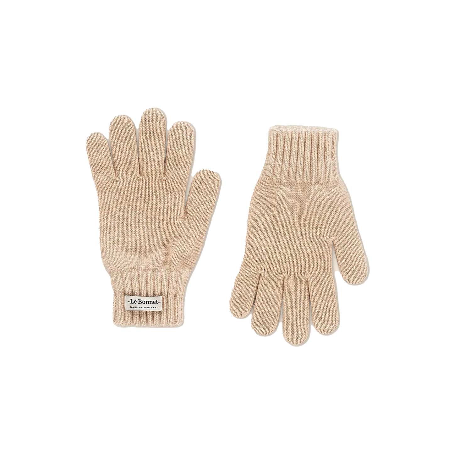 Le Bonnet's beige knitted gloves are made from Merino wool and feature ribbed cuffs along with a small label on one glove. They provide warmth and comfort, making them a stylish choice for cooler days in Scotland.