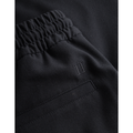 Close-up image of the Patrick Twill Shorts, Dark Navy by Les Deux with a gathered elastic waistband, stretchy drawstring waist, and a small back pocket detail.