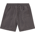 A pair of patterned men's shorts with an elastic, drawstring waistband and a geometric print design covering the entire fabric. Crafted from recycled polyester, Les Deux's Stan AOP Swim Shorts 2.0 in Dark Navy/Washed Denim Blue offer a statement swim style that's both eco-friendly and fashionable.