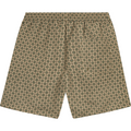 A pair of beige shorts with an all-over circular pattern in green and brown, featuring a comfy drawstring waist and crafted from 100% recycled polyester. The product is the Stan AOP Swim Shorts 2.0, Light Desert Sand/Cherrywood by Les Deux.