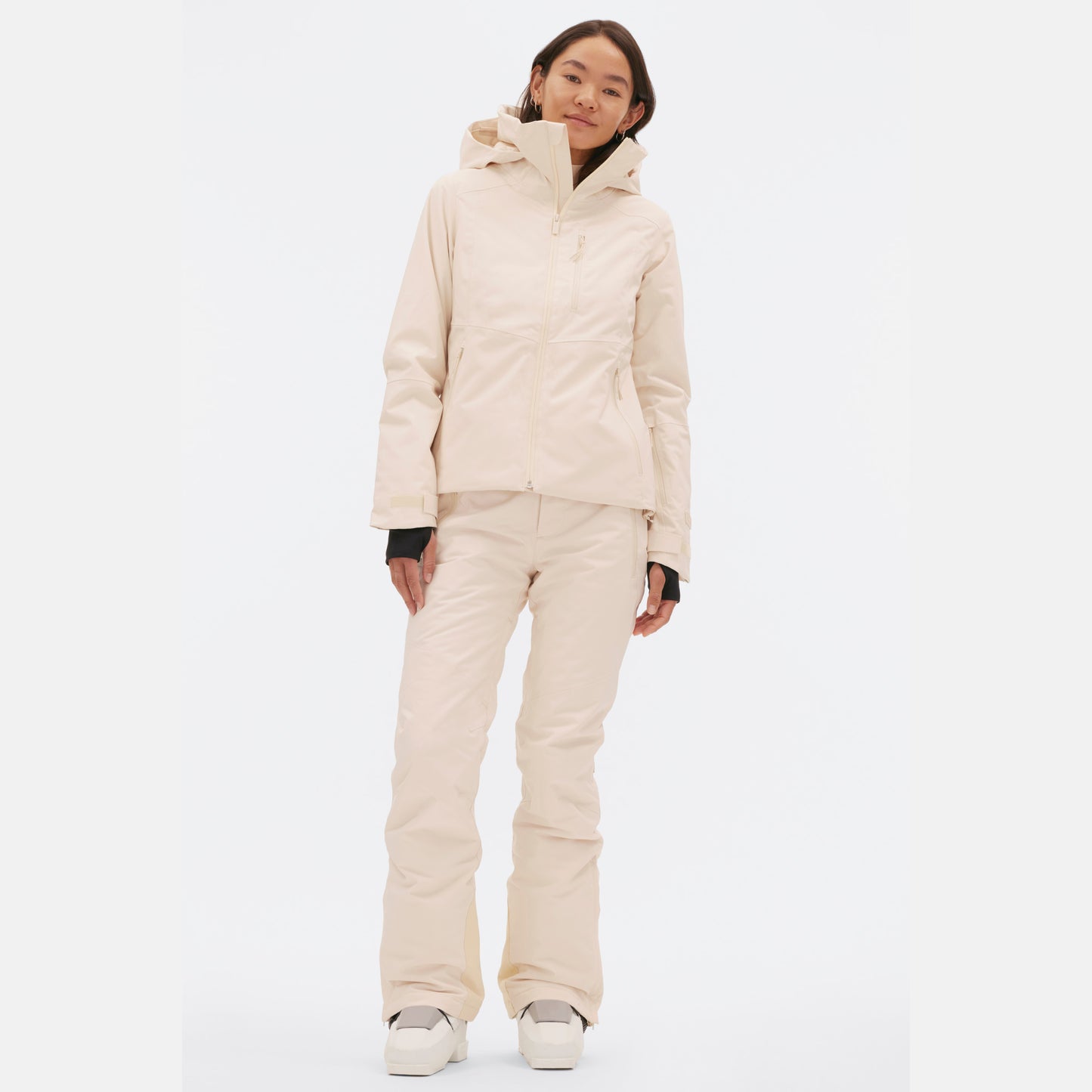 Someone wearing the Halfdays Lawrence Jacket in light beige, along with matching pants, stands against a plain white background.