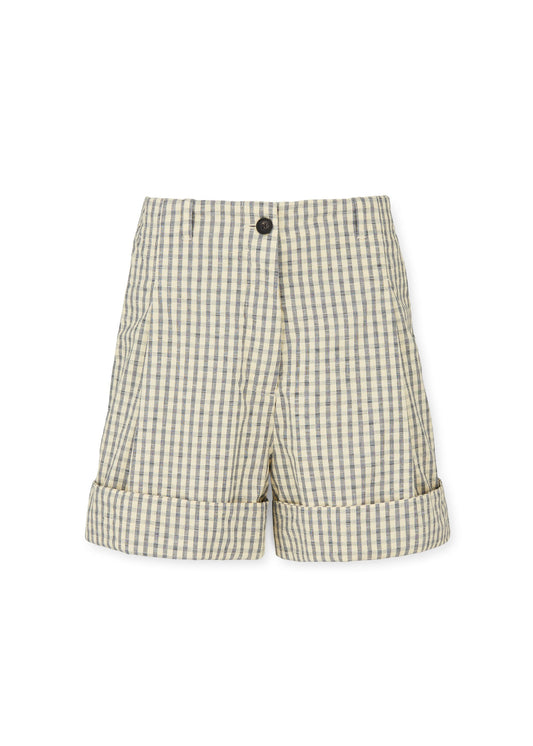 The Lee Shorts Check by Aiayu are loose-fit, beige and gray checkered shorts, crafted from 100% organic cotton. They feature cuffed hems and a single black button at the waistband.