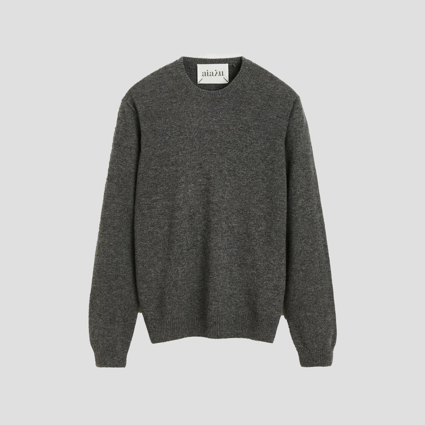 The Leonardo Cashmere Sweater by Aiayu is a luxurious gray crewneck, ideal for any genderless wardrobe.