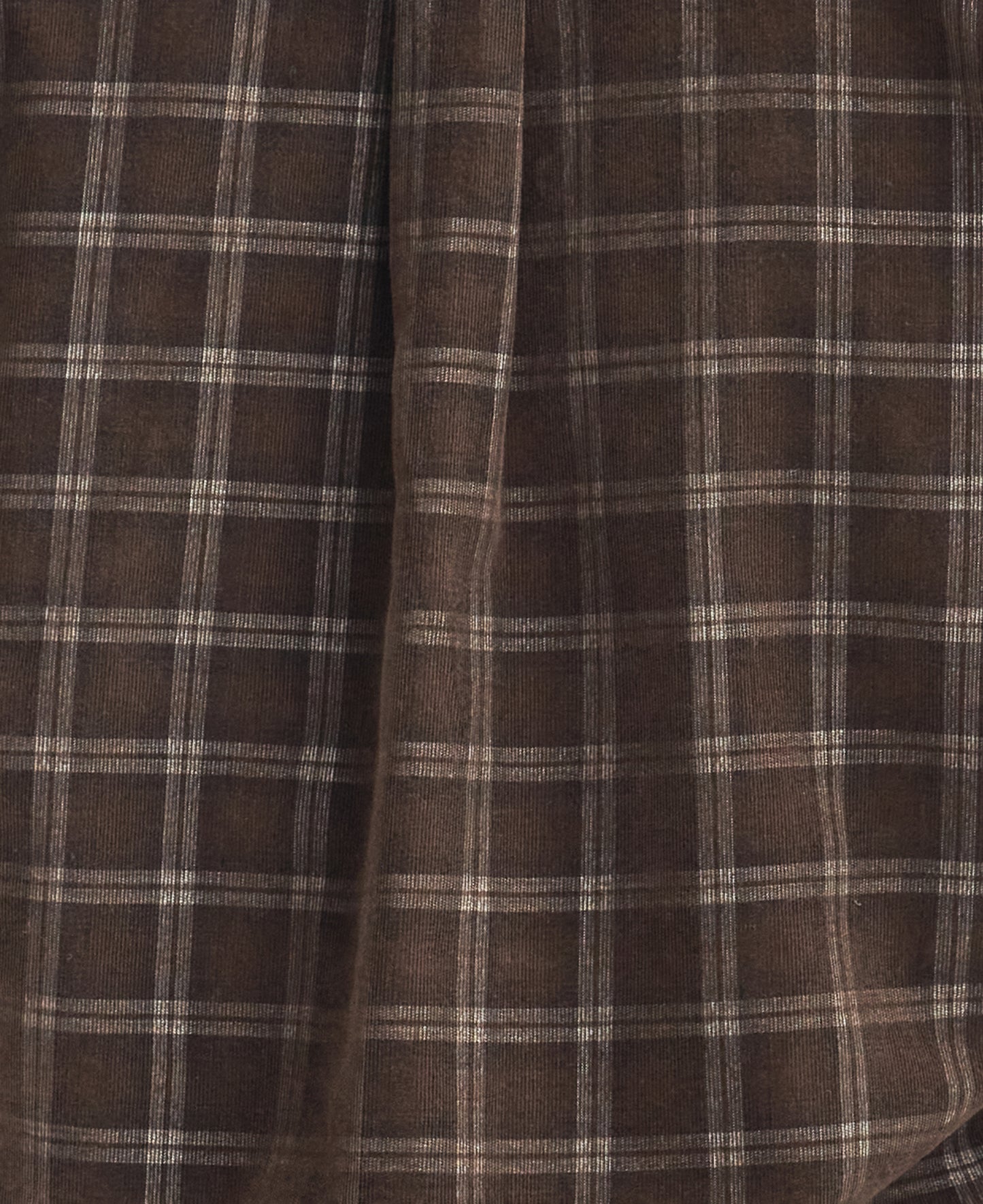 Close-up of a brown, plaid fabric with a soft texture, featuring intersecting lines forming a country check pattern reminiscent of the Barbour Harthill Tailored Long Sleeved Cord Shirt.