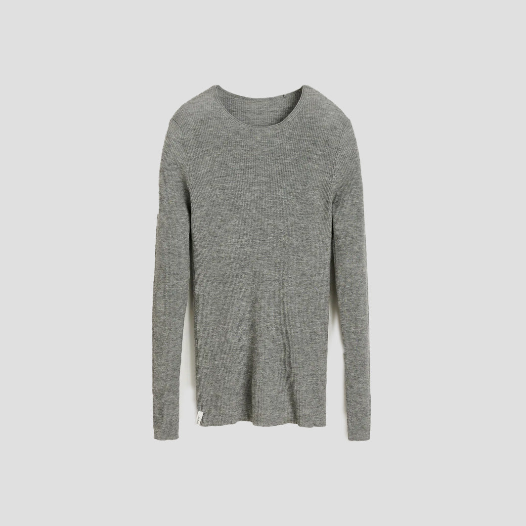 An Aiayu Madigan Ribbed Cashmere LS in gray, featuring a ribbed texture, is laid flat on a light gray background.