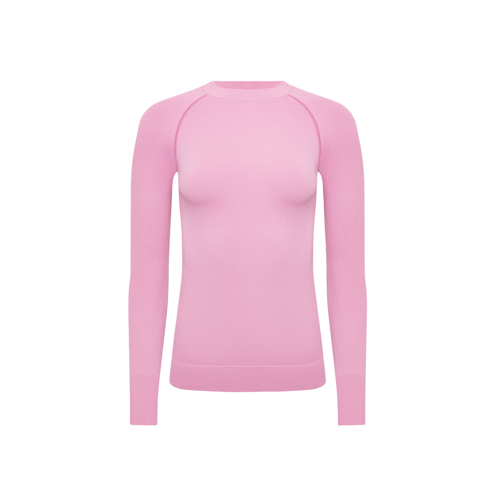 A Johnson top by Halfdays, an ultra-flattering plain pink long-sleeve sweater perfect for an active outdoor fit, showcased on a white background.