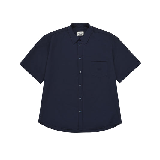 The Kappy Relaxed Seersucker Half Shirt, a short-sleeve button-up in dark blue featuring a front pocket and classic collar, is laid flat on a white background.