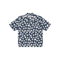 A Road Shirt by Universal Works, featuring an Indigo Flower design with short sleeves and a collar, displayed against a black background.