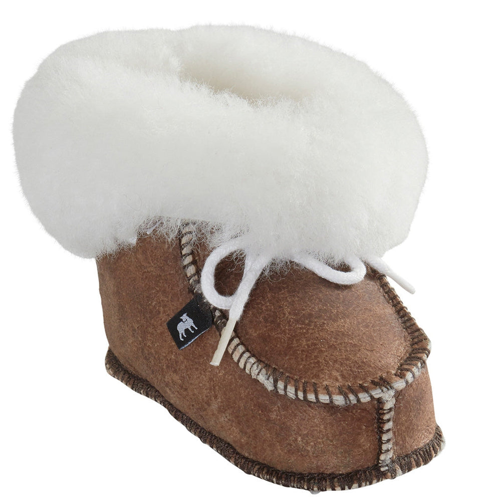 Gävle Slipper by Shepherd of Sweden in bronze, featuring a shearling collar, white wool lining and laces, visible stitching, and a small black tag.