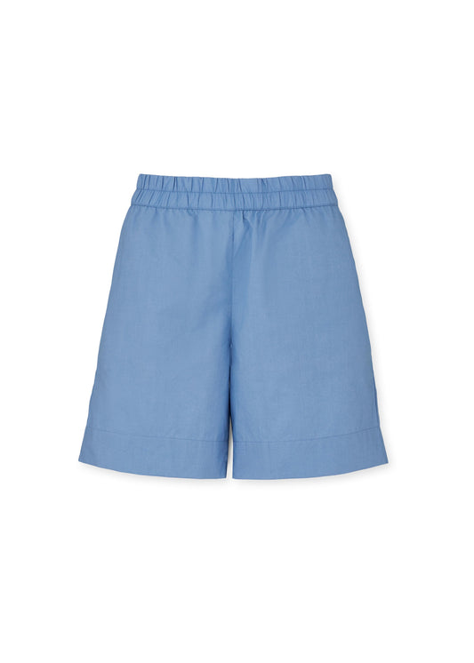 A pair of light blue summer "Shorts Long" by Aiayu, crafted from organic cotton, featuring an elastic waistband and side pockets, displayed against a white background.