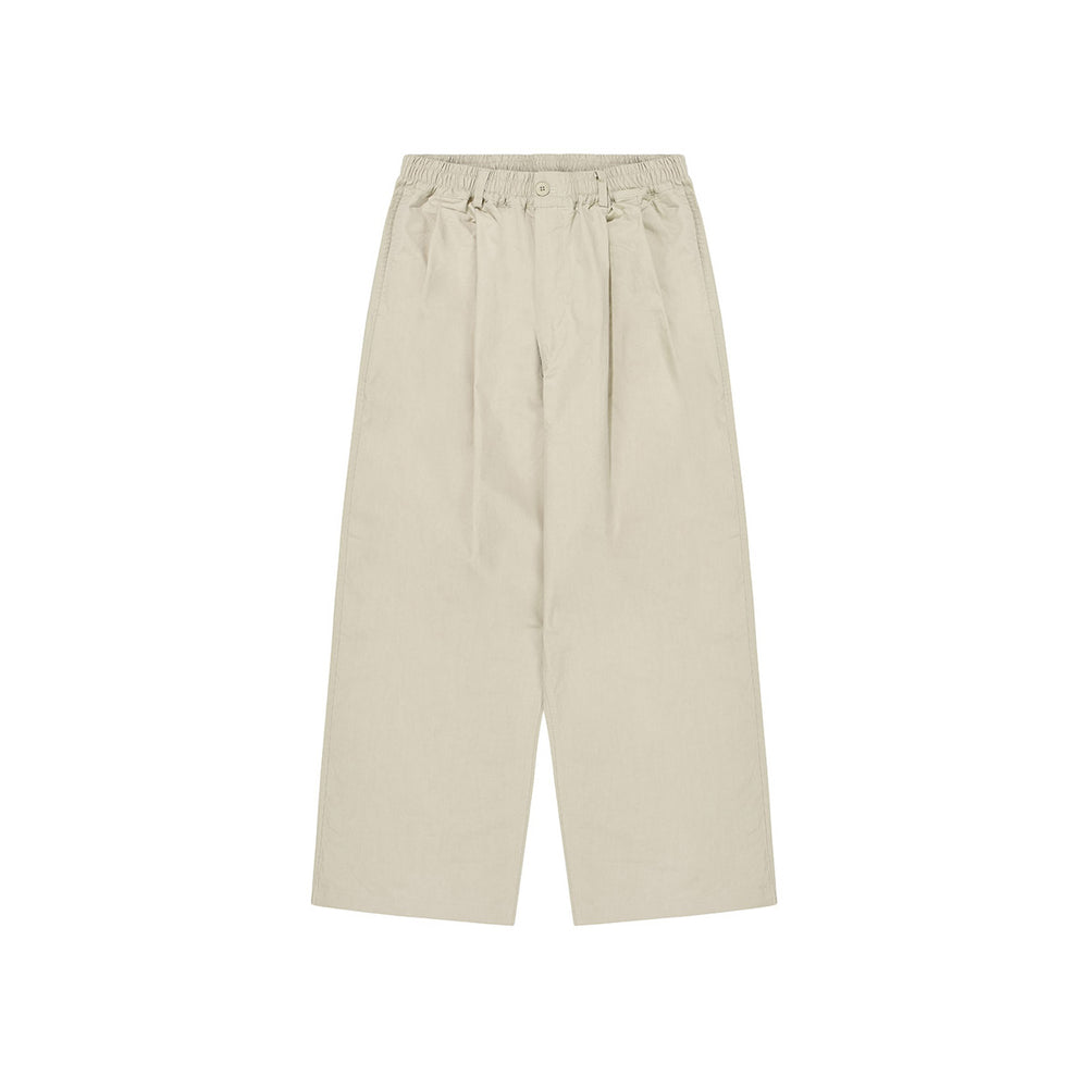 Kappy's Two Tuck Wide Half Pants in khaki feature an elastic waistband, front pleats, and button closure, showcased on a white background.