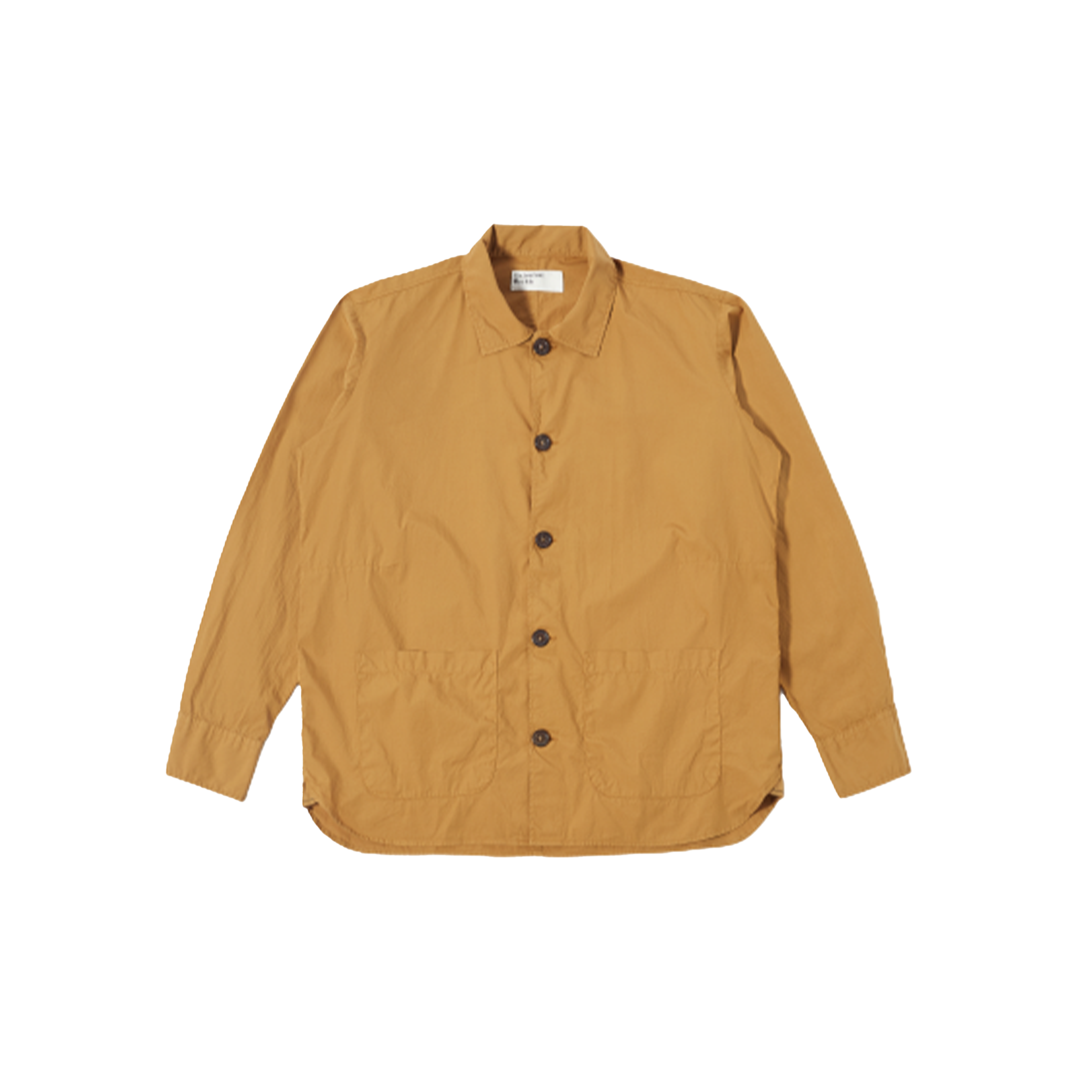 An oversized Travail Shirt in cumin by Universal Works with long sleeves, featuring a collar, two front pockets, and a stylish curved hem, displayed on a plain background.