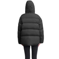 A backward-facing view of a person wearing the Nobis Una Women's Performance Puffer, featuring a black waterproof design and down-filled hood against a white background.