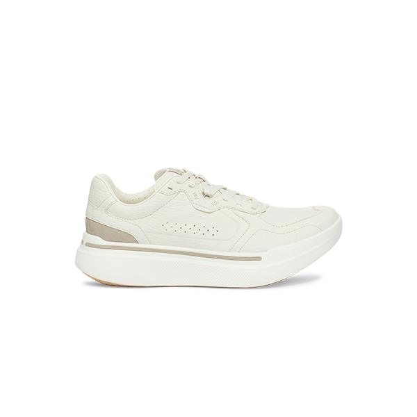 The U Sequence Sport, White by AHNU is a white low-top athletic shoe featuring a thick sole and lace-up design, shown from the side view.