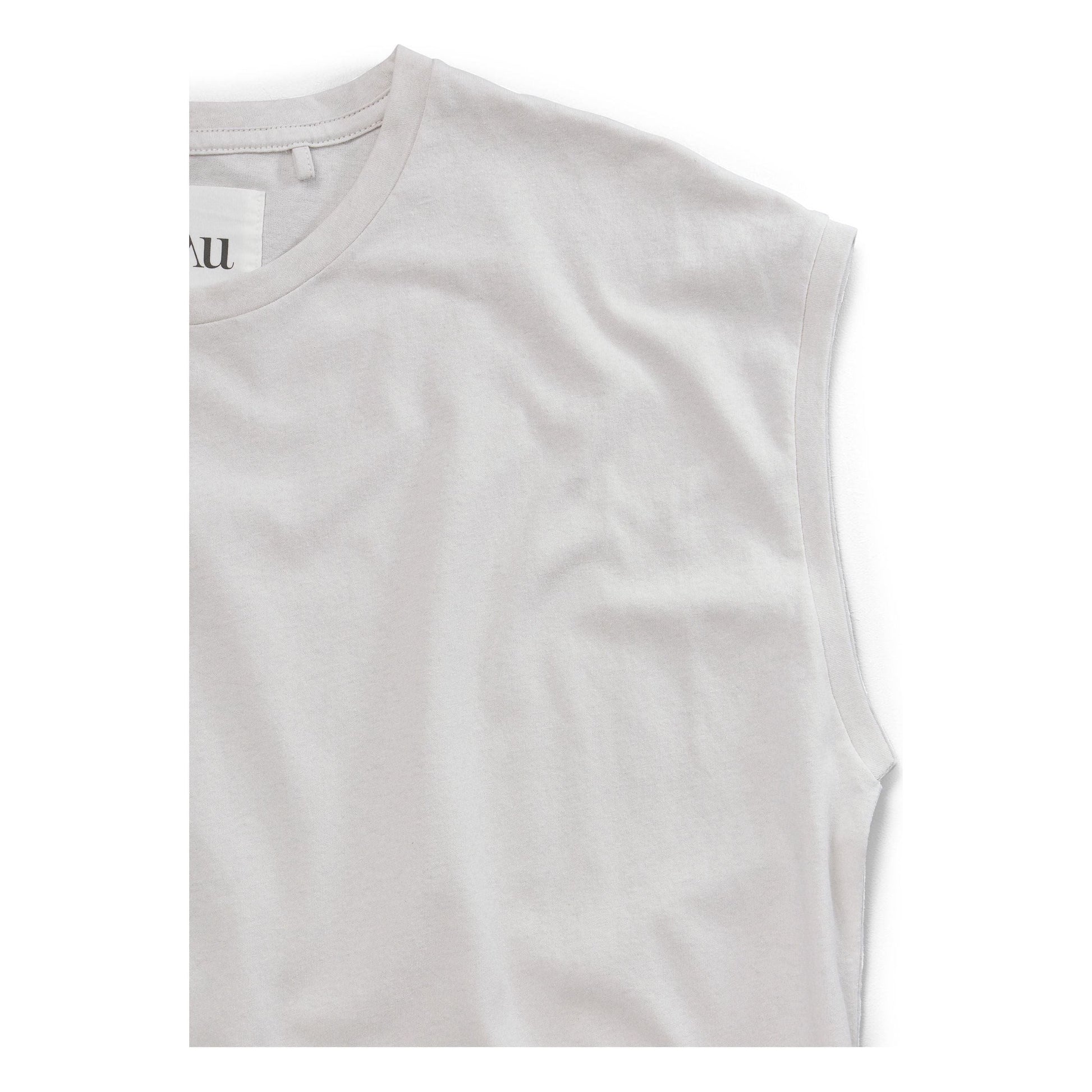 The Lia Circular Top by Aiayu is a white, sleeveless shirt with a round neck, crafted from organic cotton and displayed against a plain white background.