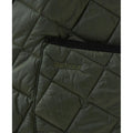 Close-up of an olive green quilted fabric with "Barbour" embroidered on it, highlighting the Men's Modern Liddesdale jacket's tailored fit. The design showcases a visible pocket with black trim.