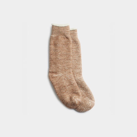 RoToTo's Double Face Crew Socks in Camel are light brown, textured women's socks that beautifully display exquisite craftsmanship and style against a plain white backdrop.