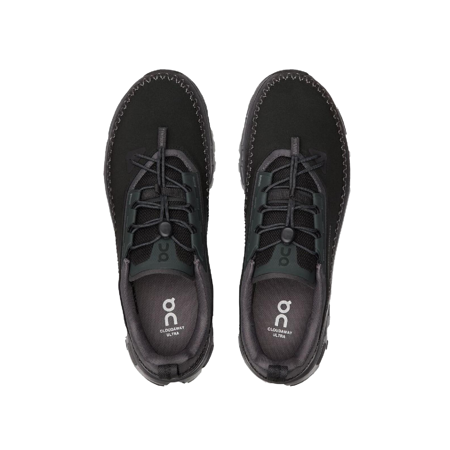 The Women's Cloudaway 2 by On Running is a pair of black adventure shoes with laces, boasting a water-repellent design and an ultra-sticky Missiongrip™ outsole, shown from above on a plain background.