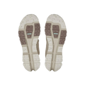 The image highlights the soles of On Running's Women's Cloudaway 2 shoes, displaying a textured pattern in beige and brown with rectangular and hexagonal shapes. The design is improved by the Missiongrip™ outsole for excellent traction and durability.