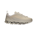 Introducing the Women's Cloudaway 2 by On Running: a beige adventure shoe featuring a perforated sole design and an ultra-sticky Missiongrip™ outsole, complete with a convenient pull tab at the heel, all showcased on a transparent background.