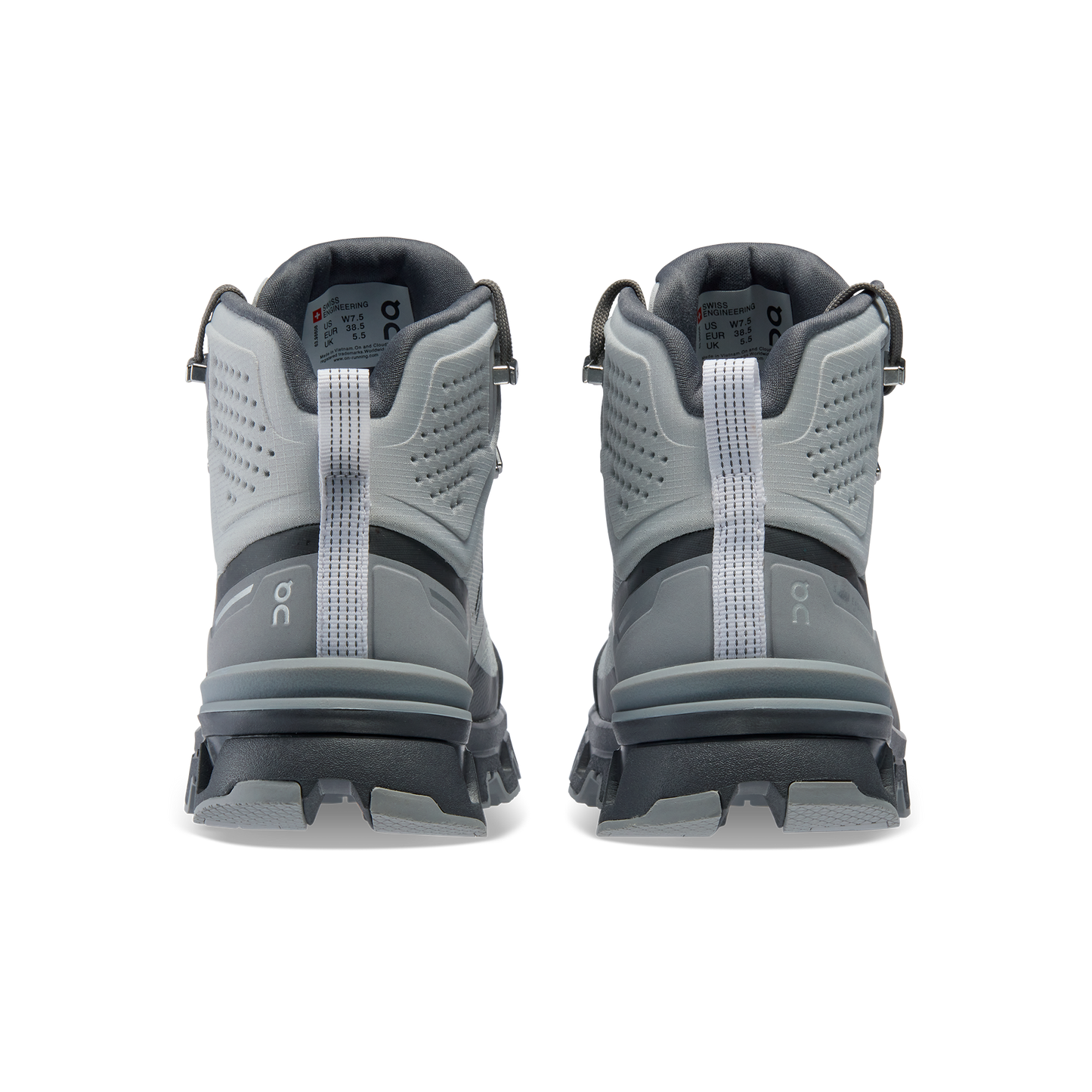 The Women's Cloudrock 2 Waterproof by On Running are gray athletic shoes shown from the back, showcasing a textured design and pull loops, with enhanced shock absorption for comfort during intense workouts.