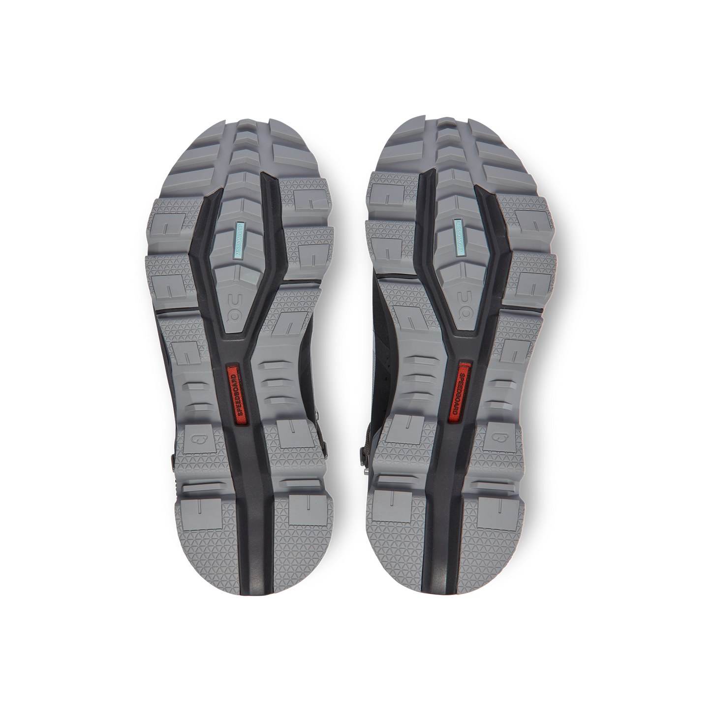 The bottom view showcases the tread patterns and red details on the gray and black soles of the Women's Cloudrock 2 Waterproof shoes by On Running, highlighted by their innovative CloudTec® outsole for a sleek appearance.